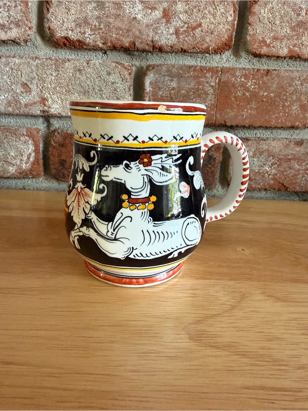 Sienna Italy Hand-Painted Ceramic Mug. Featuring white deer small chip